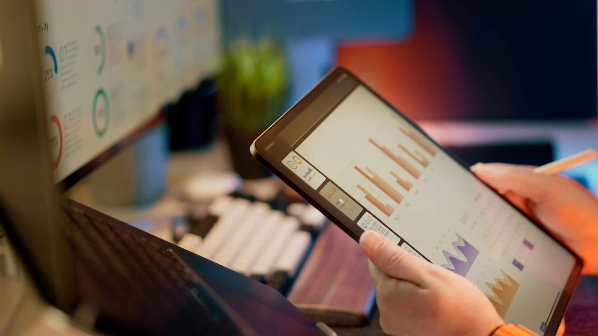 Banking professional analyzing data visualizations on tablet
